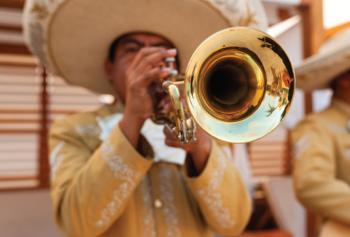 Mariachi band trumpet player wearing a sombrero